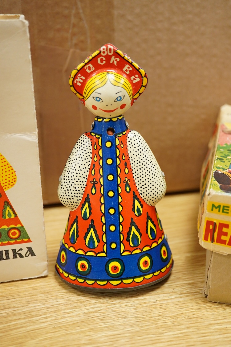 Three boxed clockwork tinplate toys - a 1960s Japanese Cubby the Reading Bear, by Alps (Japan), 17cm high, a USSR doll, and a later ‘Roli Zoli’ clown on a scooter (3)